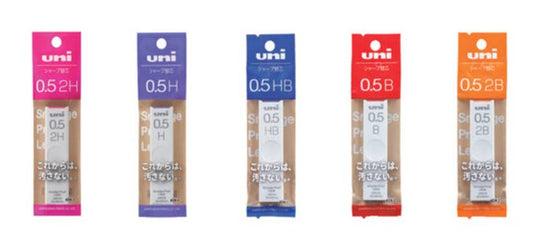Five packages of uni brand smudge proof leads with different hardness grades on a white background.