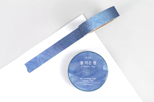 Ink masking tape with a blue design on a white background