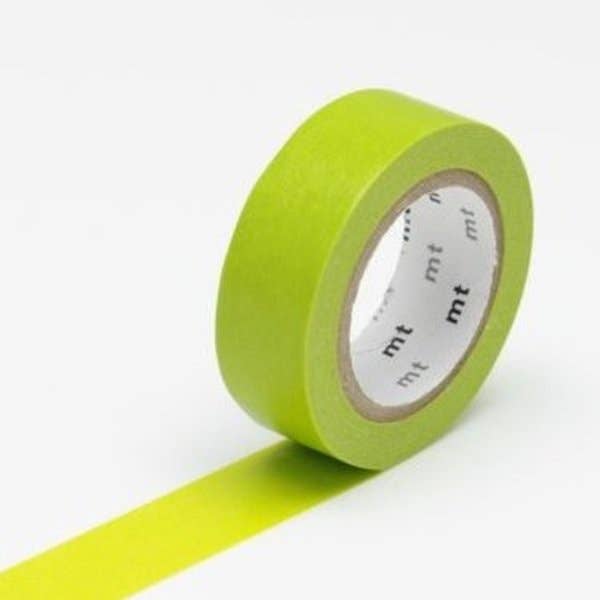 Green masking tape with a white label on a white background