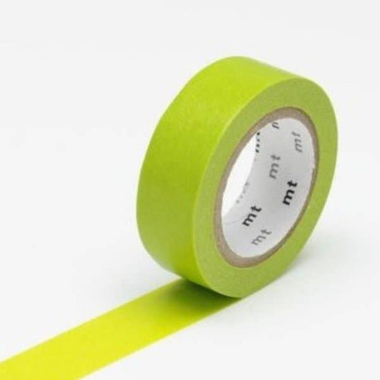 Green masking tape with a white label on a white background