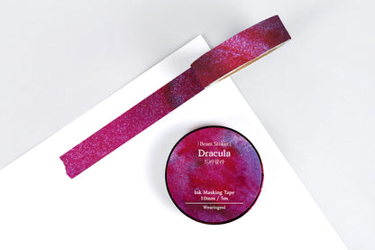 Ink masking tape with a mauve design on a white background