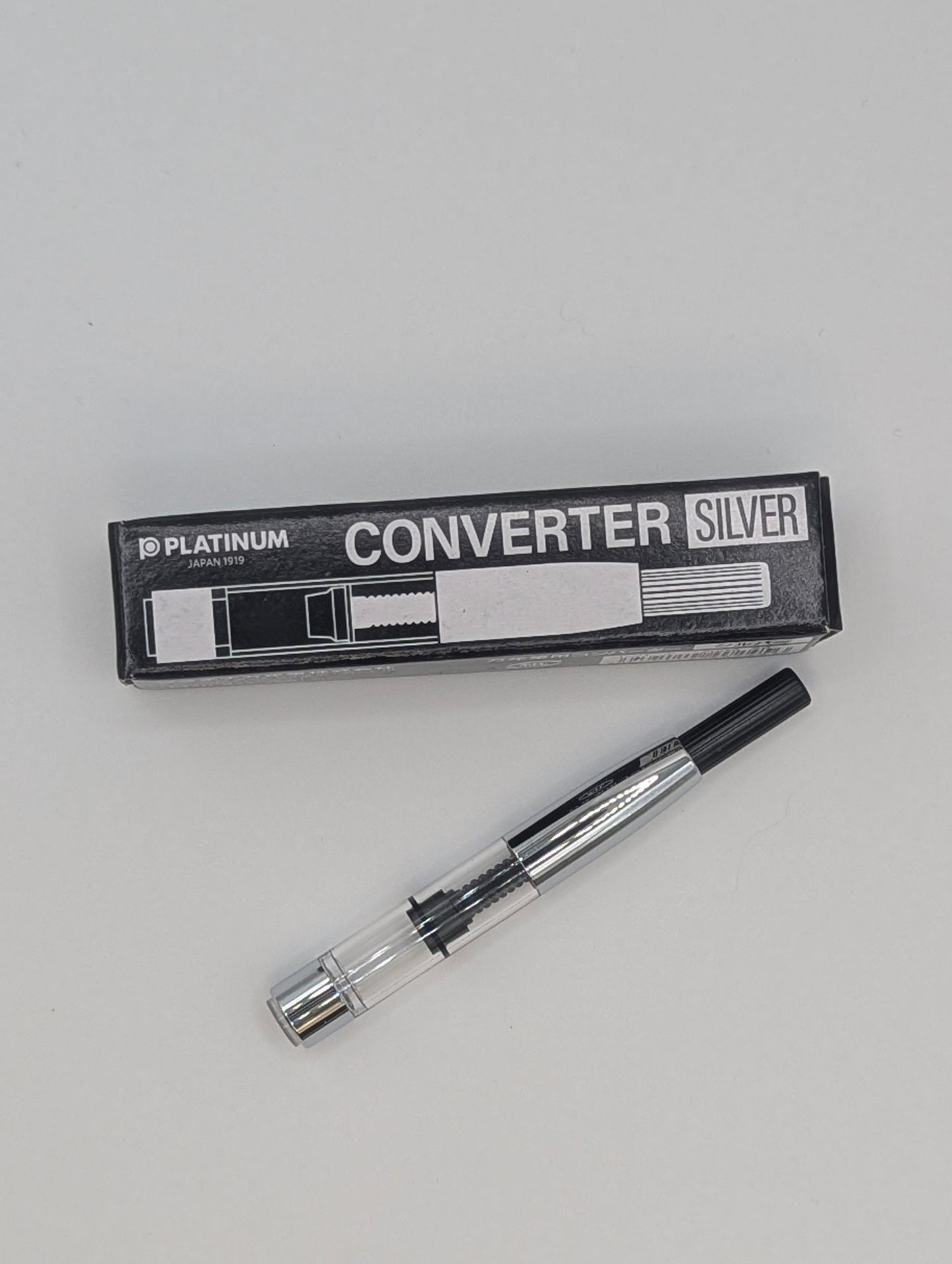 Converter silver with packaging on a gray background