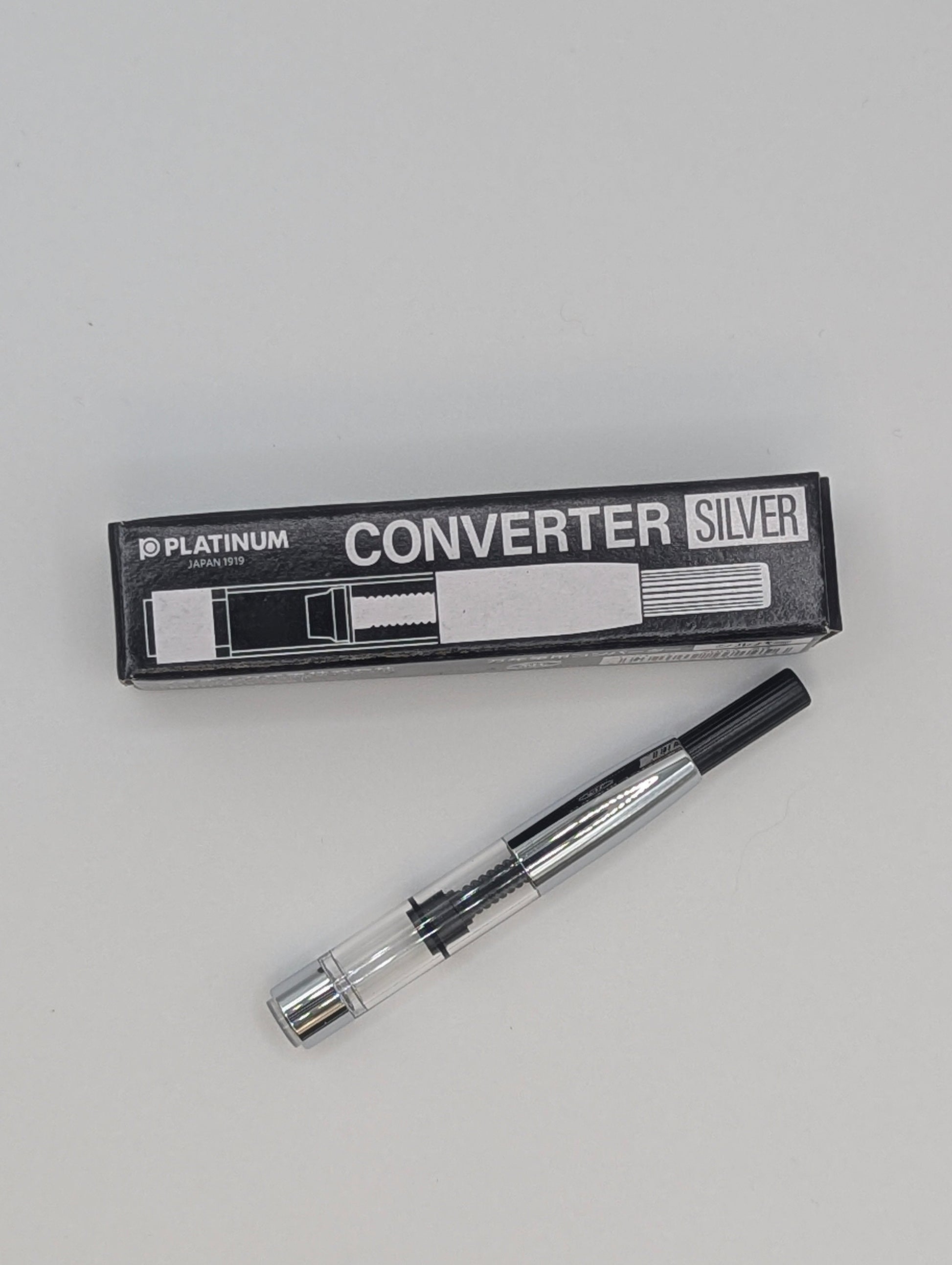 Converter silver with packaging on a gray background