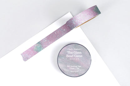 Decorative masking tape with a pink and blue sparkly design on a white background
