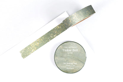 Sparkly green masking tape on a white background