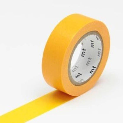 Yellow tape roll with 'mt' branding on a white background