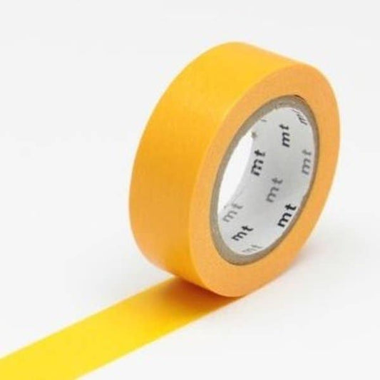 Yellow tape roll with 'mt' branding on a white background