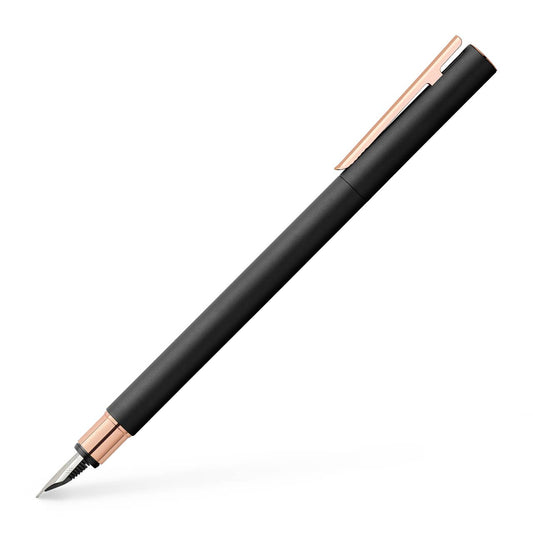 Black pen with rose gold accents on a white background