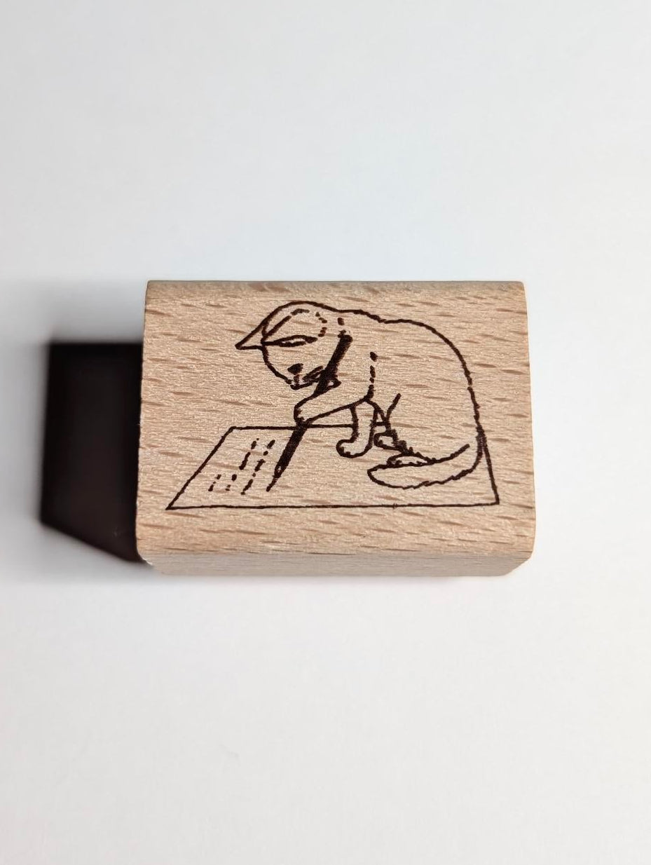 Wooden stamp with a engraved design of a dog on a white background
