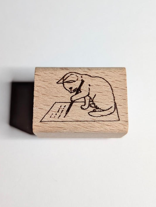 Wooden stamp with a engraved design of a dog on a white background